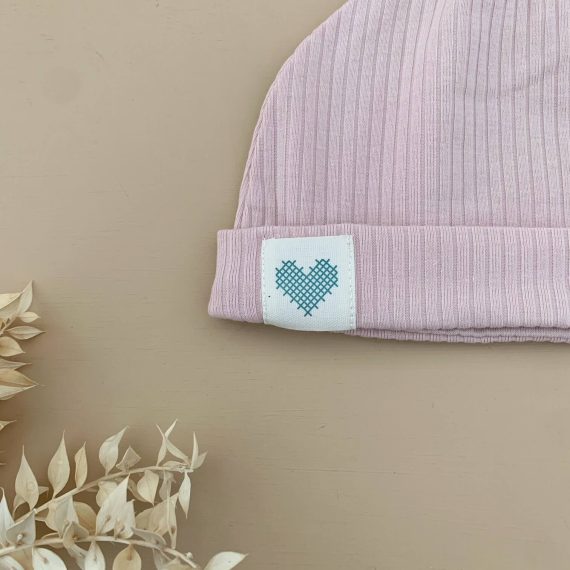 beanie pink close up of logo